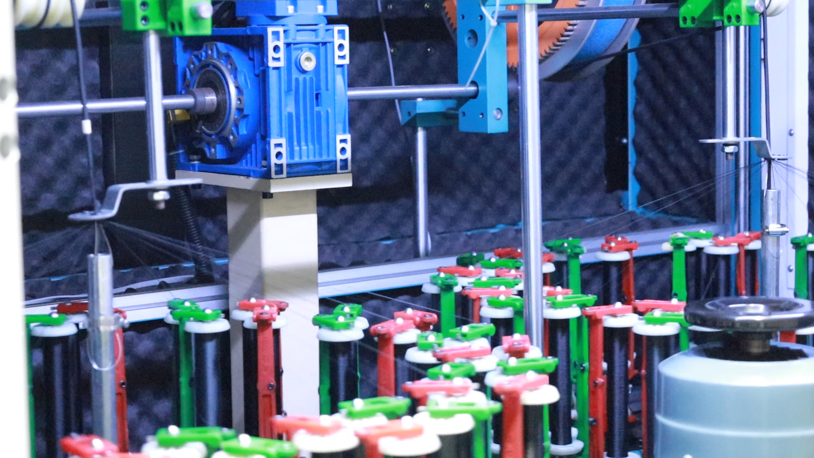 Close-up of automated cable winding equipment